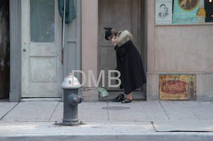 Is she on a cell phone in 1930?