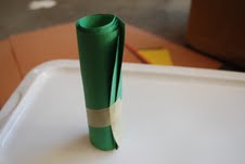 preschooler makes a tree from a toilet paper roll
