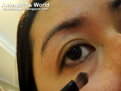 Applying Bobbi Brown Corrector