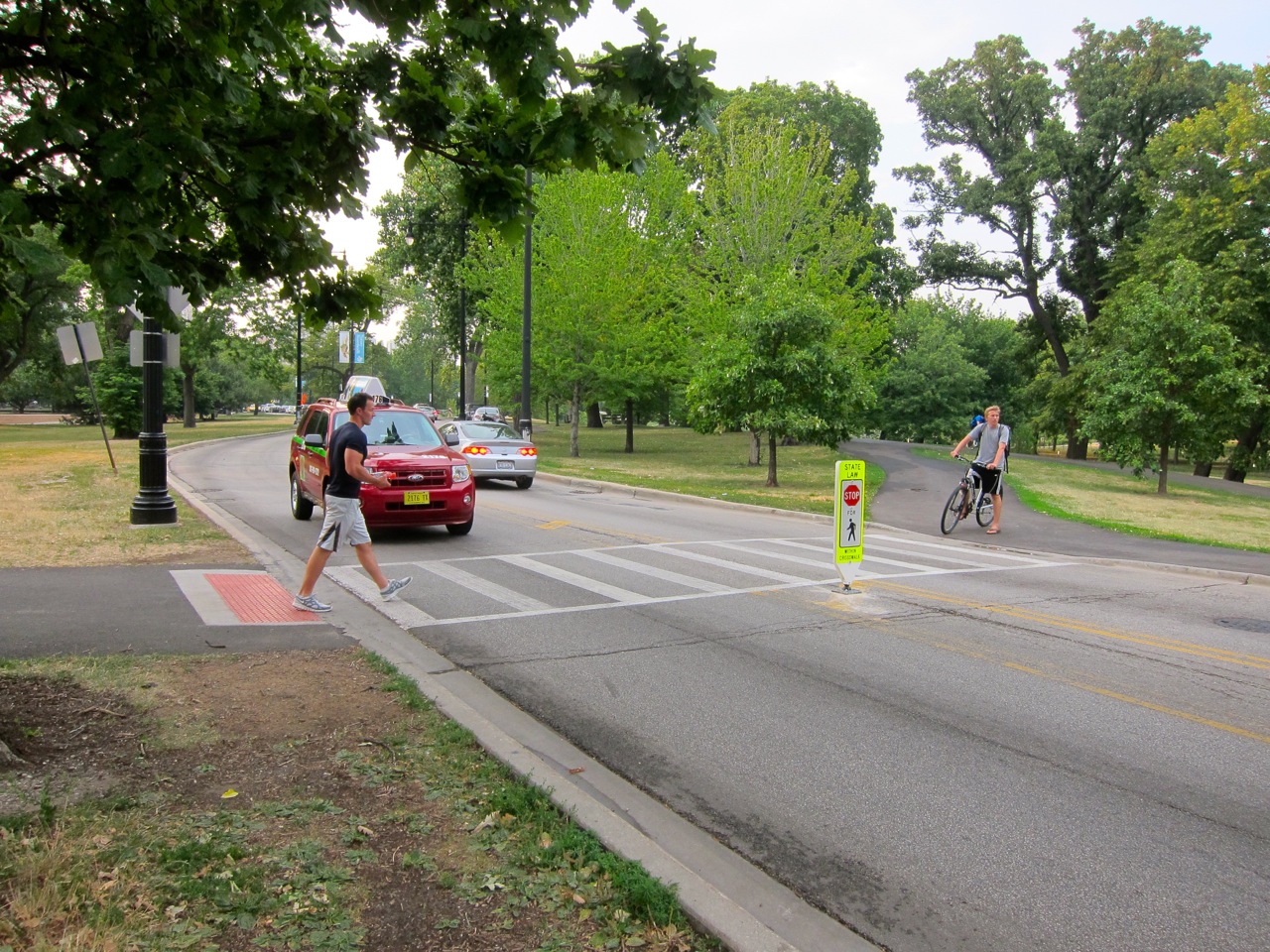Bike Walk Lincoln Park First "Stop For Pedestrian" sign appears on