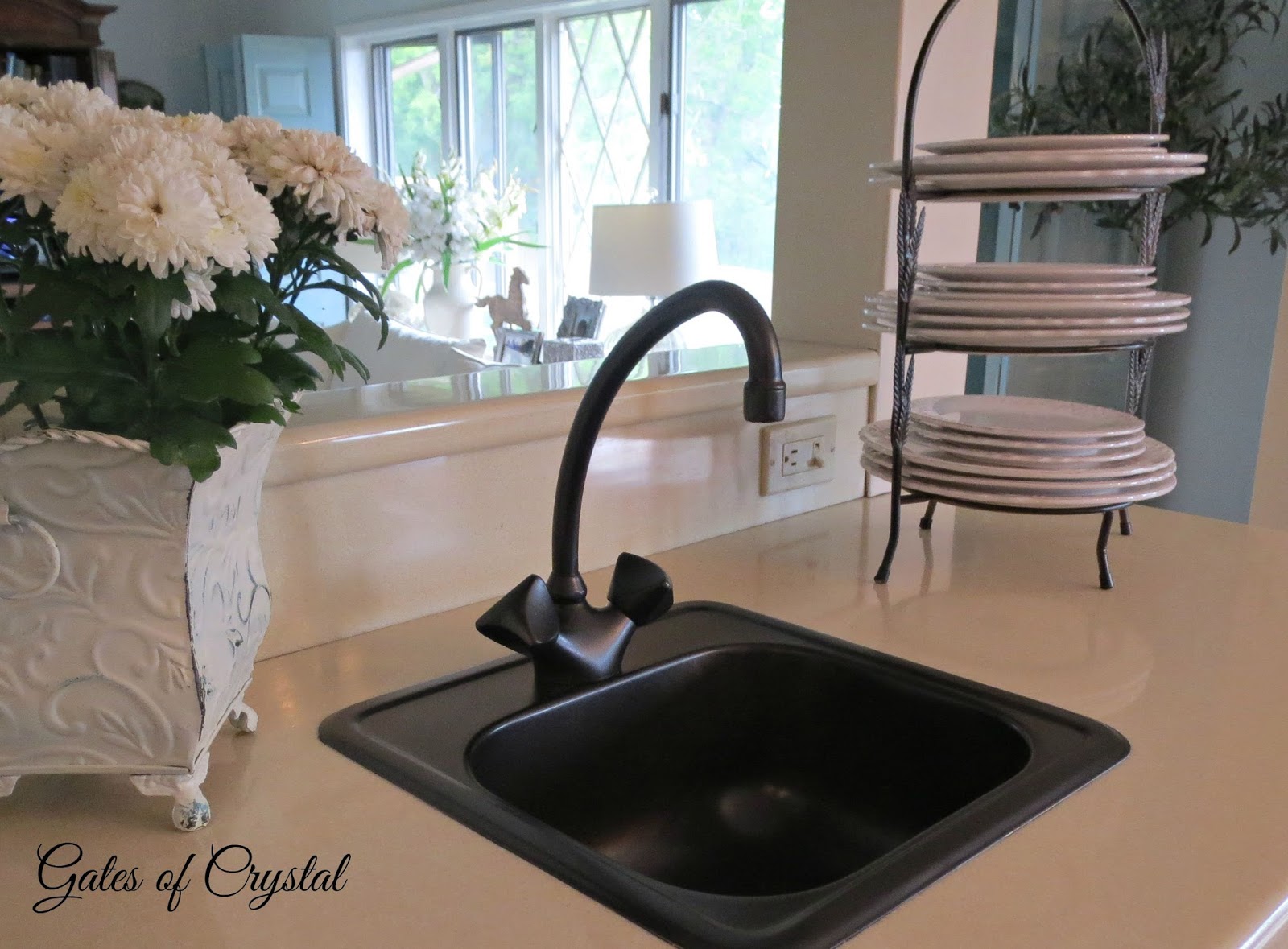 Gates of Crystal Spray Painting a Brass Sink