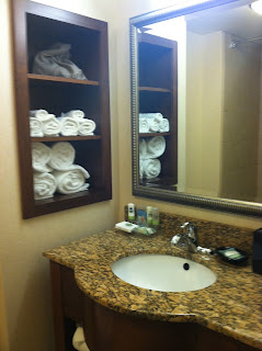 a bathroom with a mirror and a sink