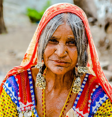portrait of a tribal women wearing ethnic jewellery in Hampi