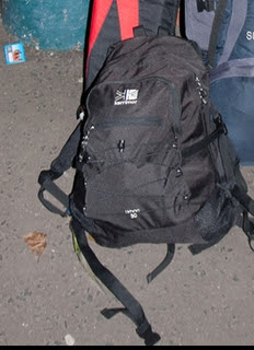 a black backpack on the ground