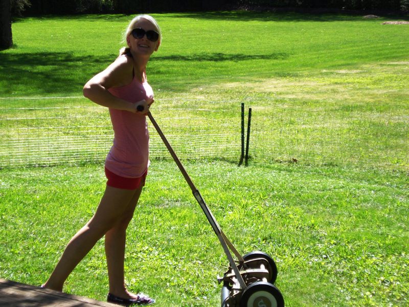 Natasha Kizmet mows her lawn with a GreenWorks 20 inch 