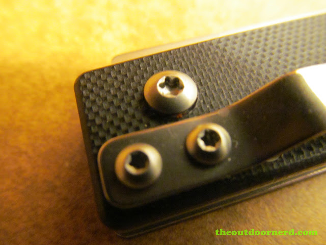 Sanrenmu 704 Folding Pocket Knife showing closeup of clip and screws Sanrenmu 704 Folding Pocket Knife showing closeup of clip and screws