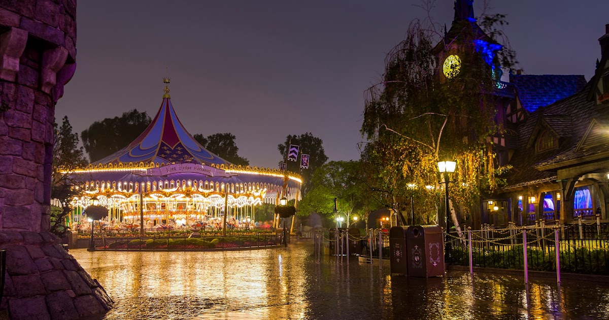 glistening and glowing on a rainy night disneyland lights on