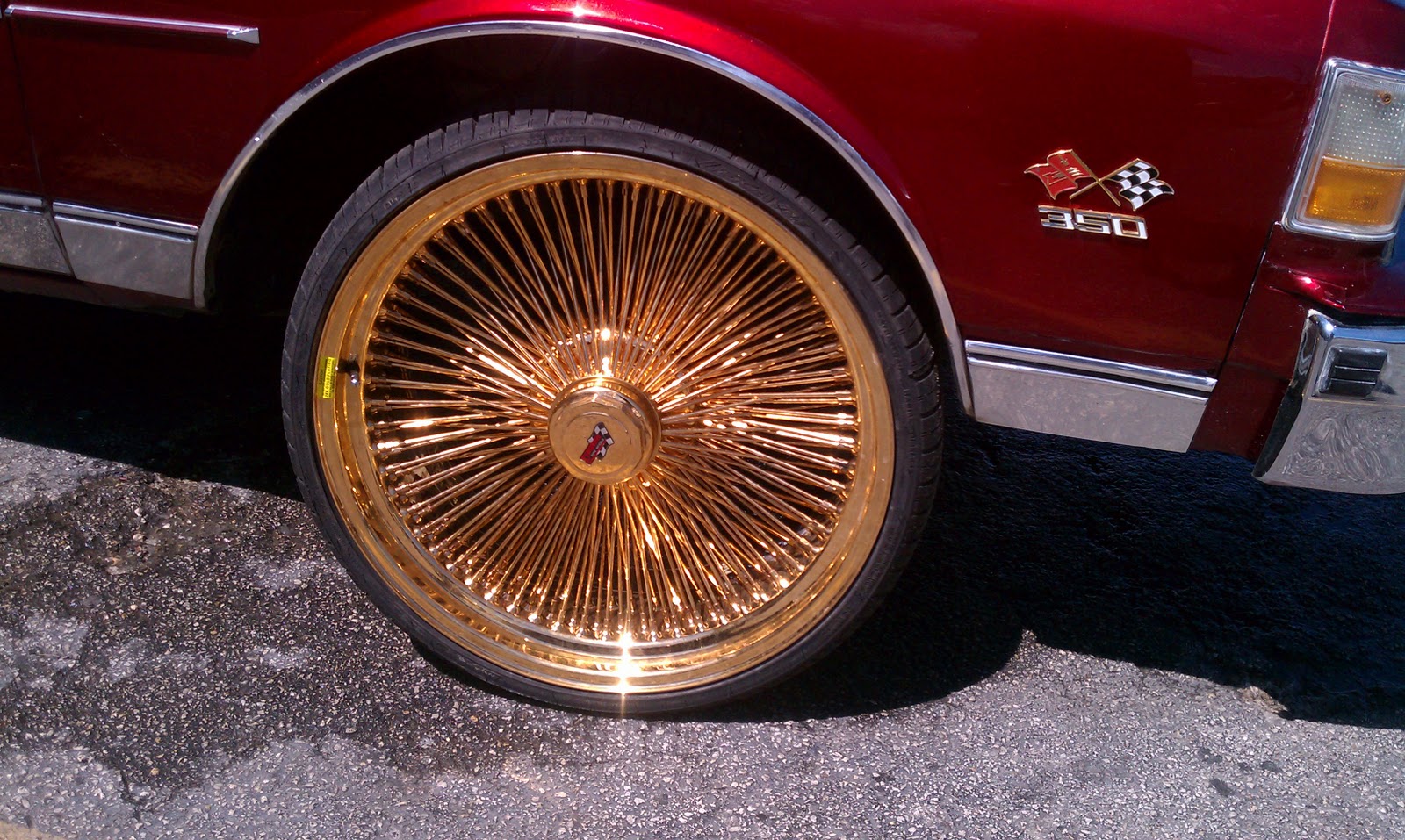 Cadillac On Dayton Rims Gold.