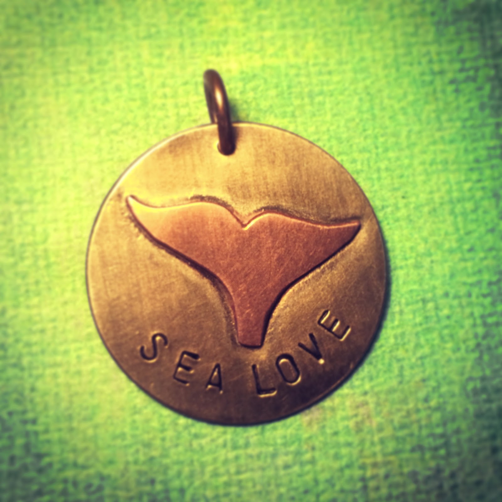 Sea Love keychain Brass keychain with sea love stamped on it and a whale tale sweat soldered in copper to the top