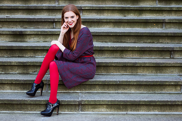 Retro style fashion blogger outfit with red tights and button up dress