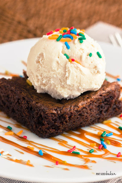 Brownies a la mode! Three ingredient brownies with a big scoop of ice cream, caramel and sprinkles. 