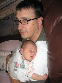 02/14/2011 - sleeping on dad's shoulder and holding tight