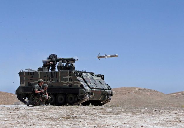 A Lebanese army vehicle fires a TOW-II missile in the village of Taybeh, near Baalbek, eastern Lebanon, Wednesday, June 10, 2015 TOW-II live firing
