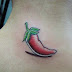 Art Tattoo feminina nuca pimenta