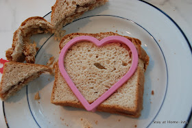 use a cookie cutter to create a heart shaped sandwich for valentine's day school lunch