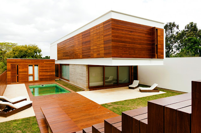 Picture of wooden facade on the house and wooden floors in the backyard