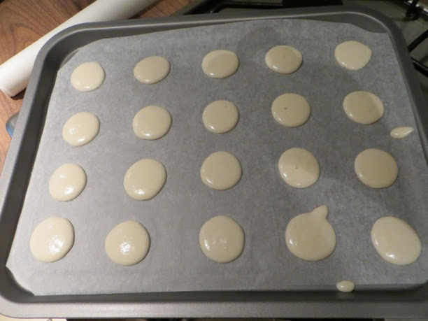 French macarons ready to go in the oven nicely piped macarons