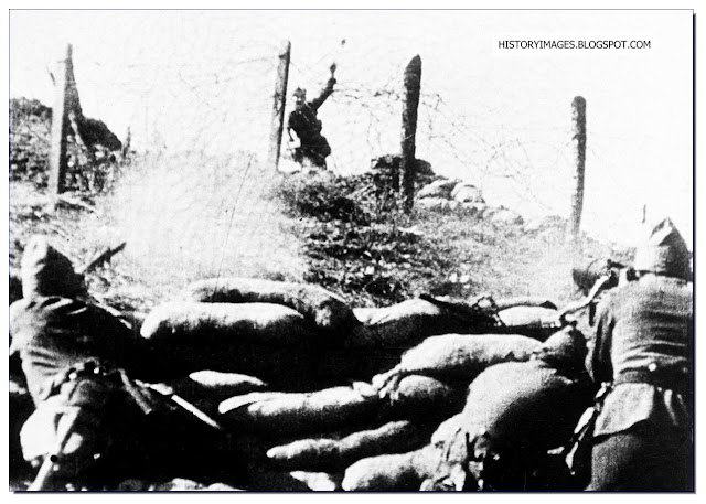  1936 Burgos Spain Nationalist soldier tosses  grenade  Republican positions  Loyalist soldiers fire