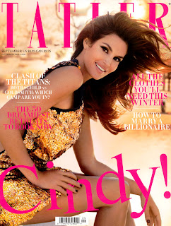 Cindy Crawford in a gold dress on the cover of the magazine