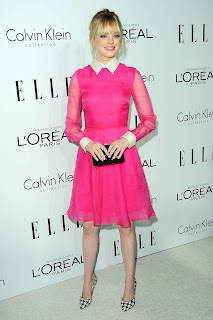 Emma Stone in a pink dress posing for cameras