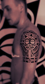 A typical tribal totem tattoo on the arm