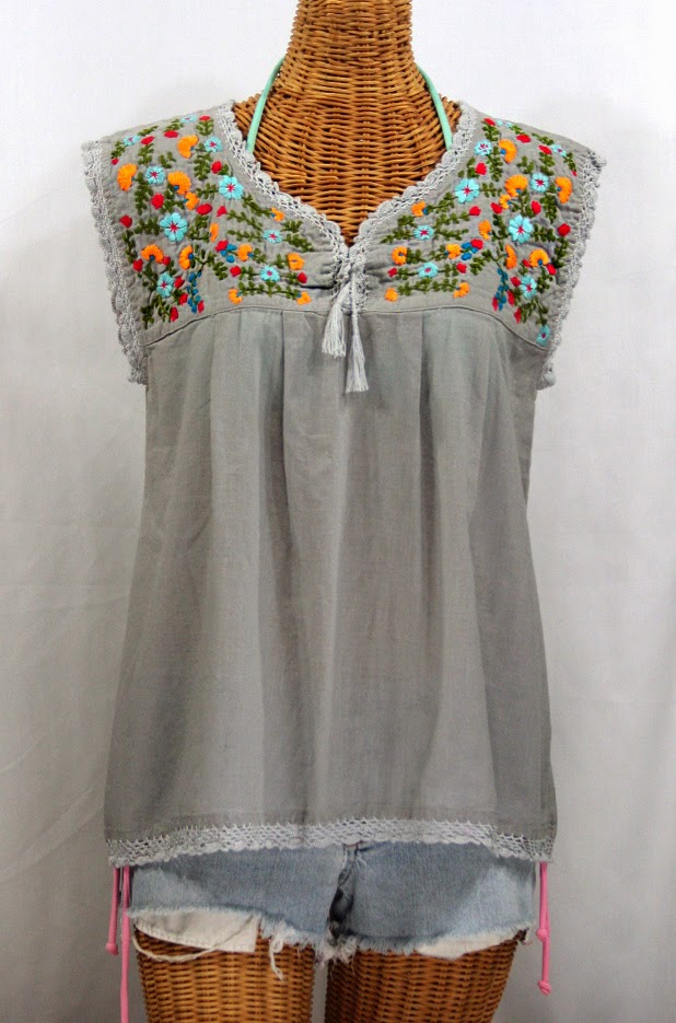 http://www.sirensirensiren.com/shop/new!-embroidered-peasant-tops/marbrisa-sleeveless-peasant-blouse/embroidered-sleeveless-mexican-peasant-blouse-marbrisa-grey