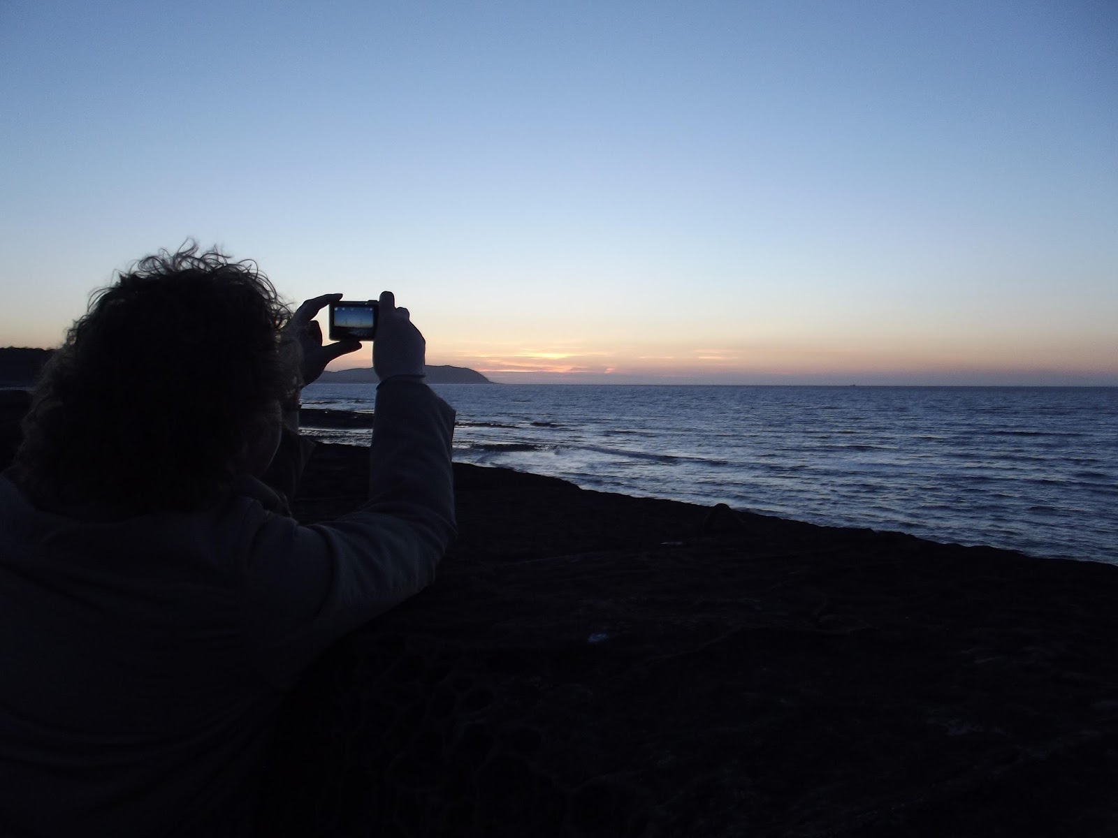 Lynda taking a photo of the sunset.
