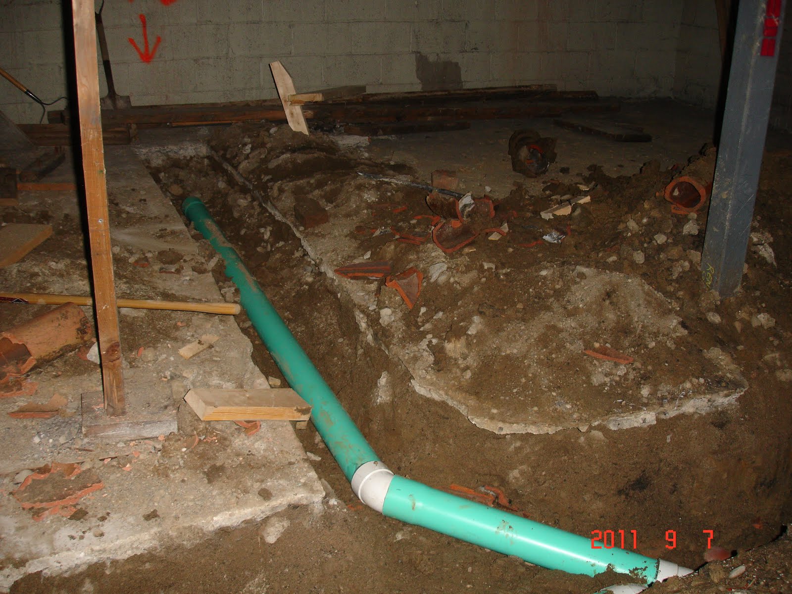 The Reno Coach Passive House Project in Toronto Drain pipes aere being layed in Basement Backup
