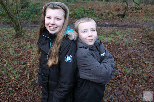 Brother and sister in woodland setting