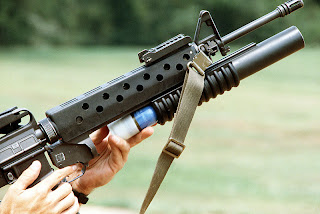 Loading an M203 attached to an M16A1 Loading an M203 attached to an M16A1