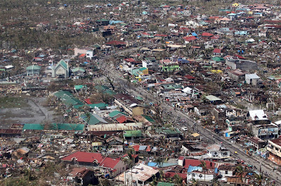 This handout photograph taken on November 10, 2013 and released by the Malacanang Photo Bureau (MPB) shows an aerial view of the damage in Leyte following Super Typhoon Haiyan in the area. The death toll from a super typhoon that decimated entire towns in the Philippines could soar well over 10,000, authorities warned Sunday, making it the country's worst recorded natural disaster. 