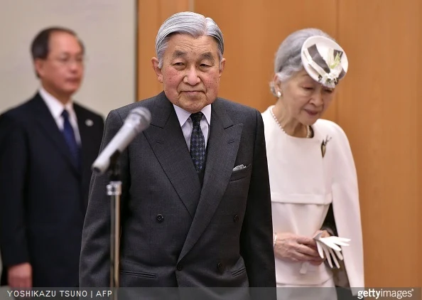 Japanese Emperor Akihito and Empress Michiko enter a room to say good bye to Crown Prince Naruhito and wellwishers as they leave to Palau at the Tokyo International Airport
