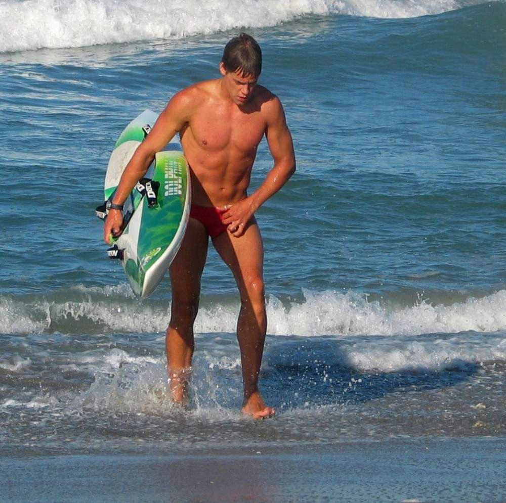 Surfer in Red Speedos.