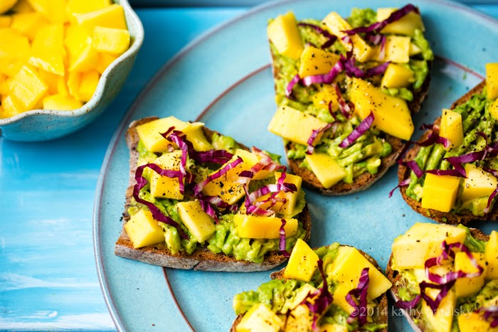 Platter of avocado toast with fruit Platter of avocado toast with fruit