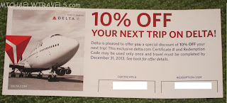 a coupon on a green surface