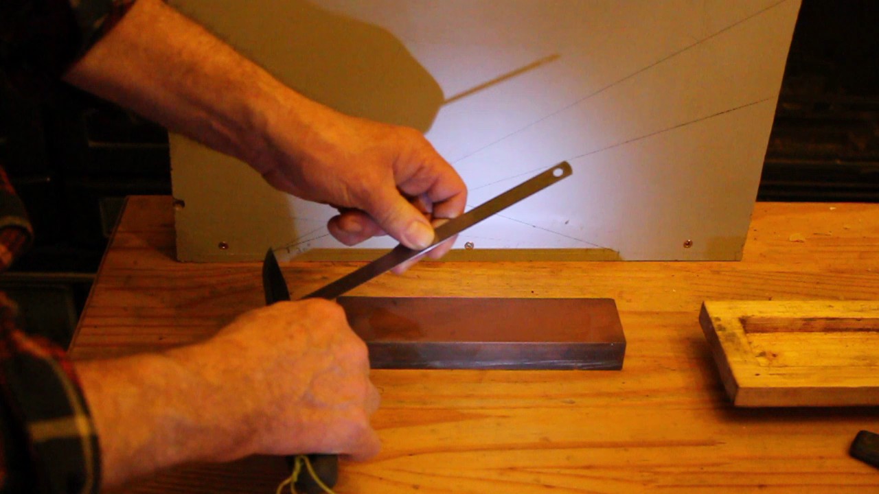 Sharpening knives using my homemade honing guide flashlight method