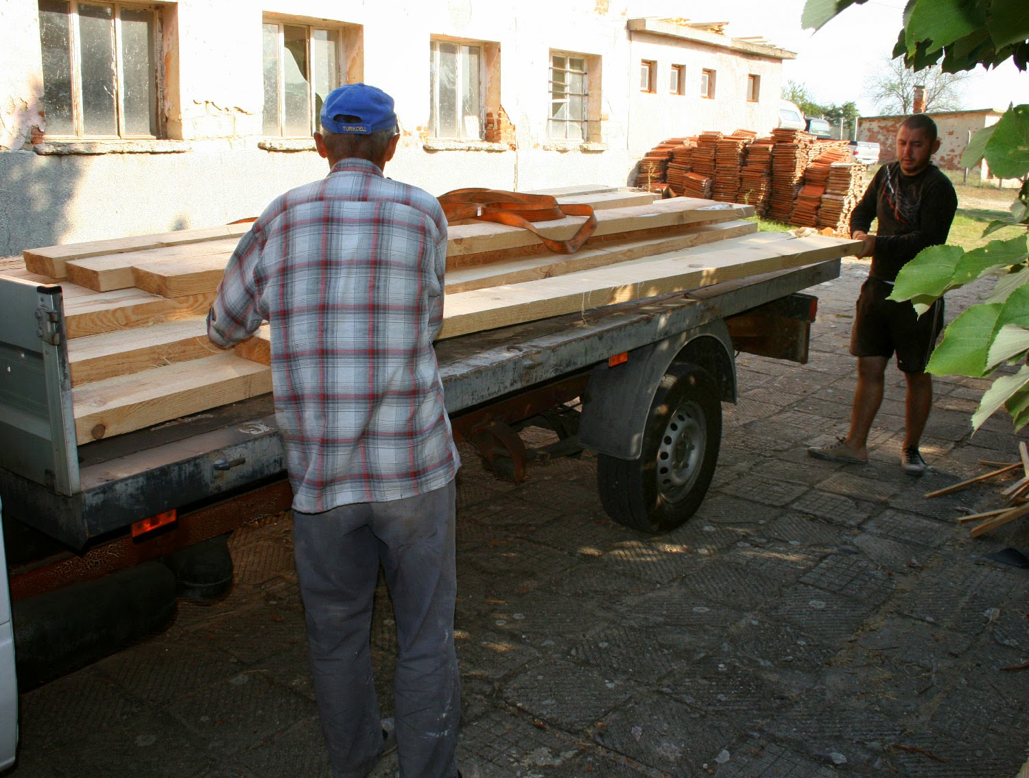 Sally and Orhan unloading my wood Sally and Orhan unloading my wood