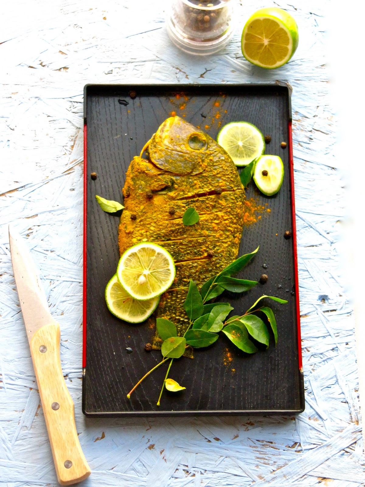 Plateful Karimeen pollichathu — Pearlspot fish grilled in banana leaf