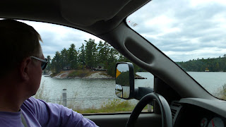 Anders driving the truck, looking at the lake side