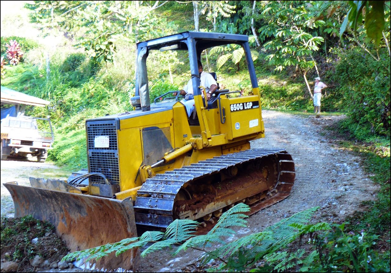 D4 bulldozer starting the grade from top of driveway