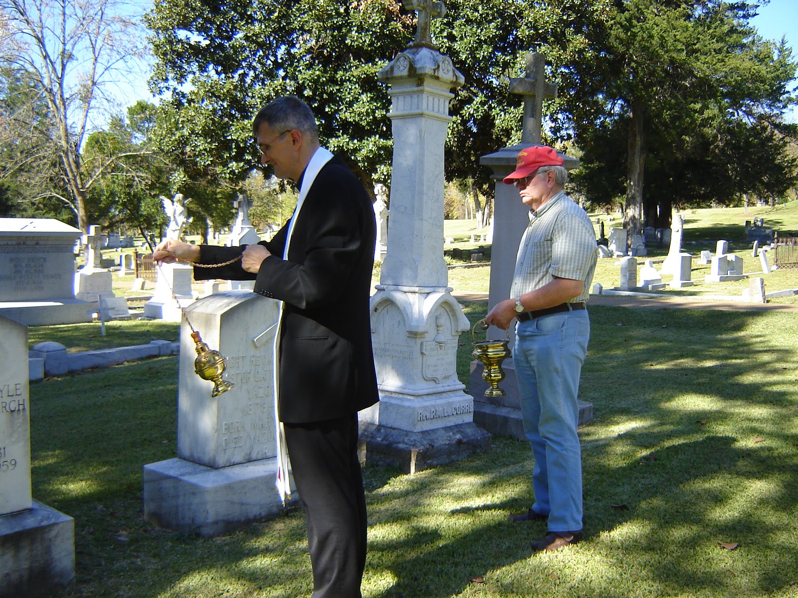 A Catholic Priest in Mississippi Blessing of the Graves at Glenwood