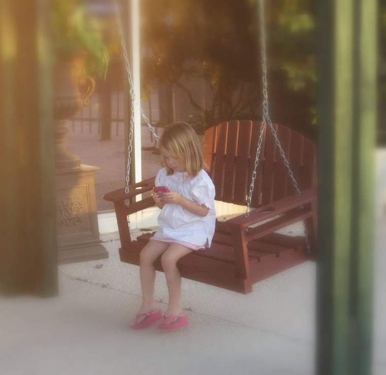 Child enjoying the swing arbor