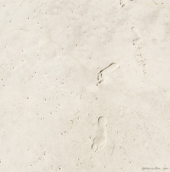 Walking barefoot on soft beach sand by Garance Doré