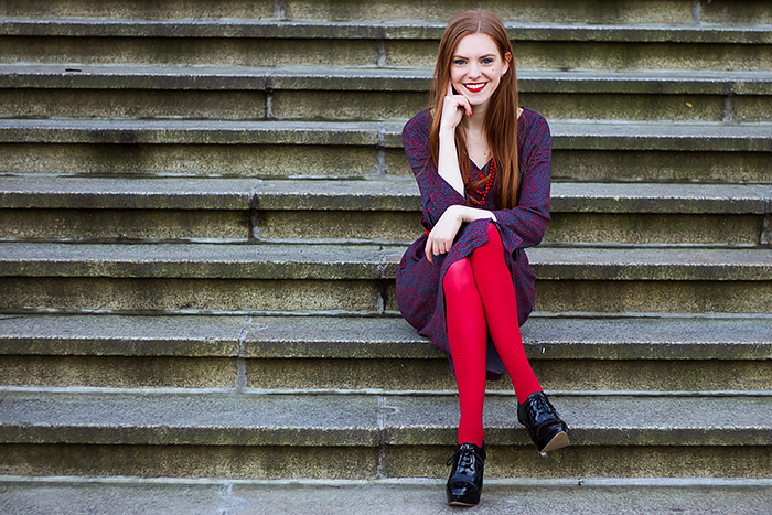 Retro style fashion blogger outfit with red tights and button up dress
