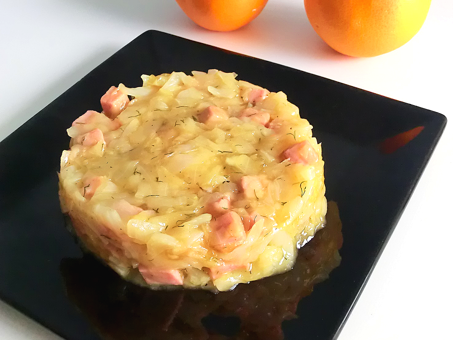 Cavolo cappuccio con prosciutto e salsa d'arancia