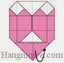 Bước 11: Gấp cạnh giấy về phía mặt sau. Bước 11: Gấp cạnh giấy về phía mặt sau.