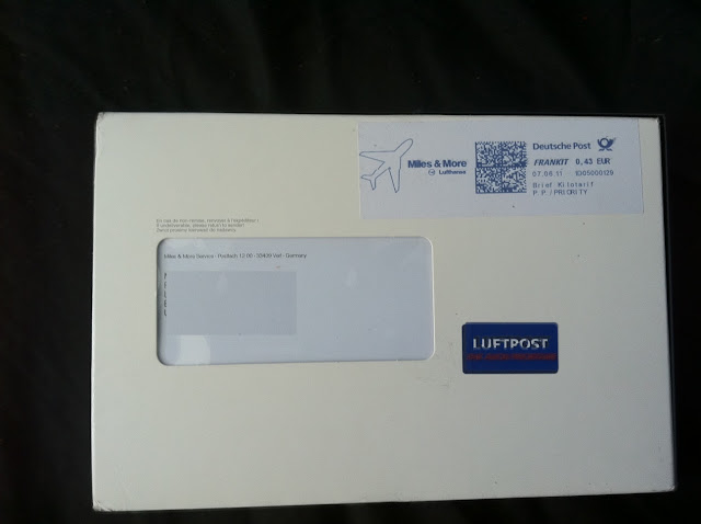 a white envelope with a sticker on it