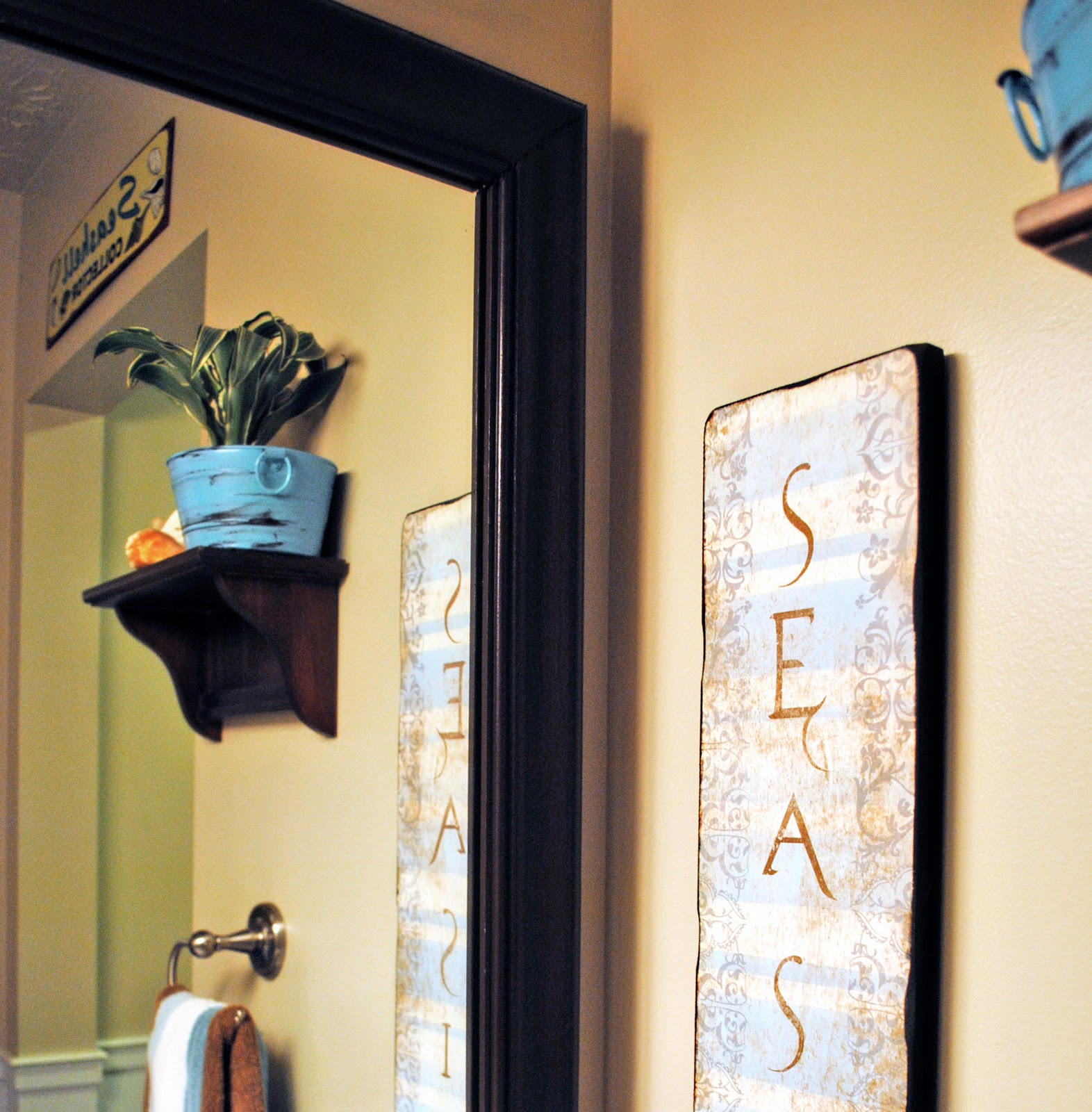 Taking My Guest Bathroom Out Of The 1990 S At Picket Fence I Thought About Removing The Builder Grade Vanity Mirror And Ing A New One But Large For This Space Would Have Been Pretty Y