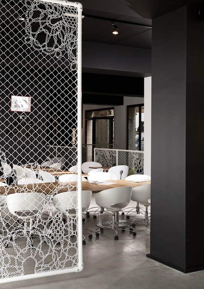 If It's Hip, It's Here (Archives) Turning Chain Link Fencing Into Art