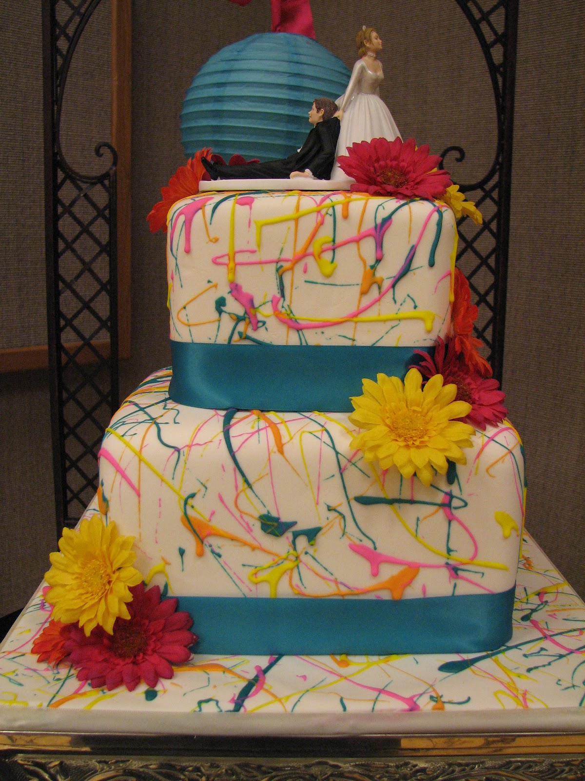 Decadent Designs Keri's Paint Splatter Wedding Cake and Cupcakes